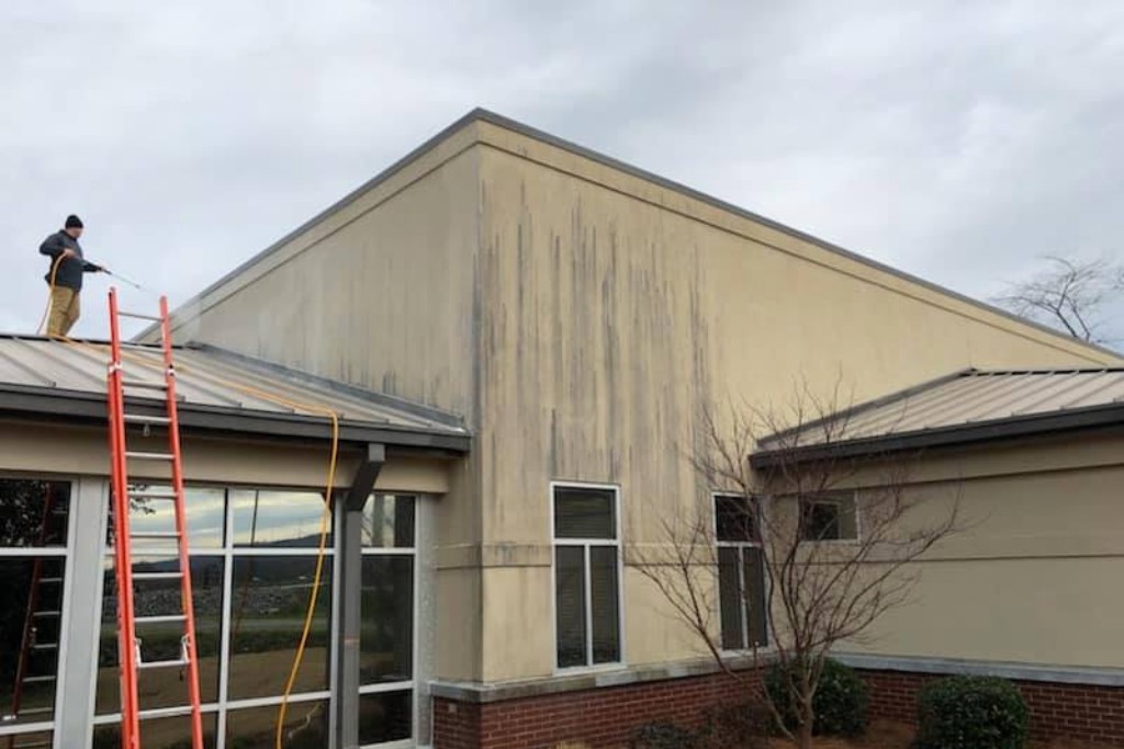 commercial building brick and brown siding with professional cleaning siding