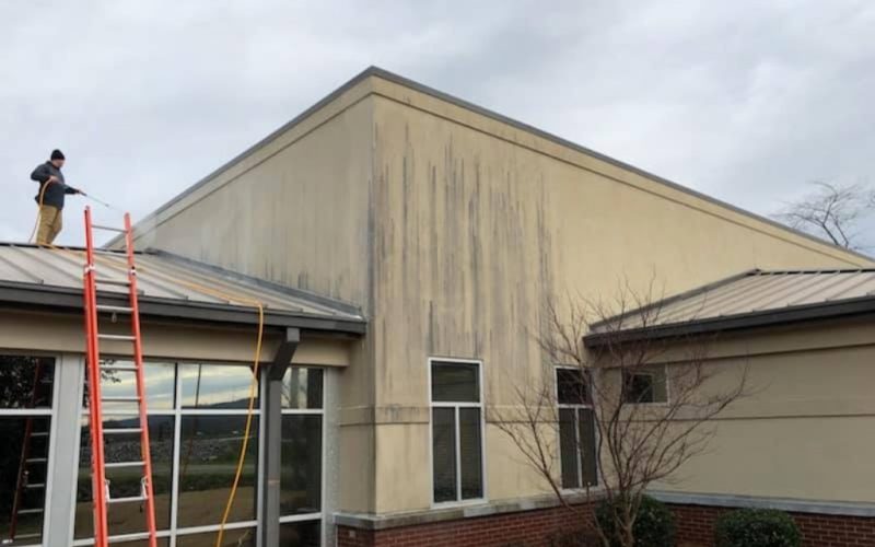 commercial building brick and brown siding with professional cleaning siding